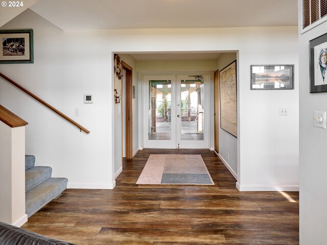 foyer with french doors and dark wood-type flooring