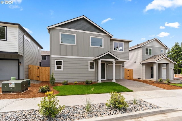 view of front of house with a garage and central AC unit