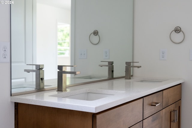 bathroom featuring double sink and large vanity