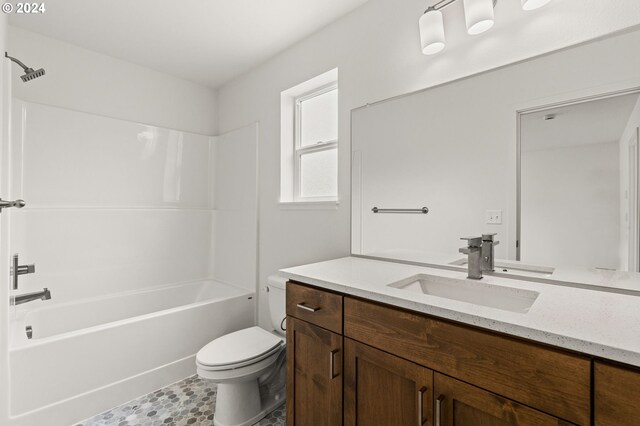 full bathroom with tile flooring, oversized vanity, toilet, and tub / shower combination