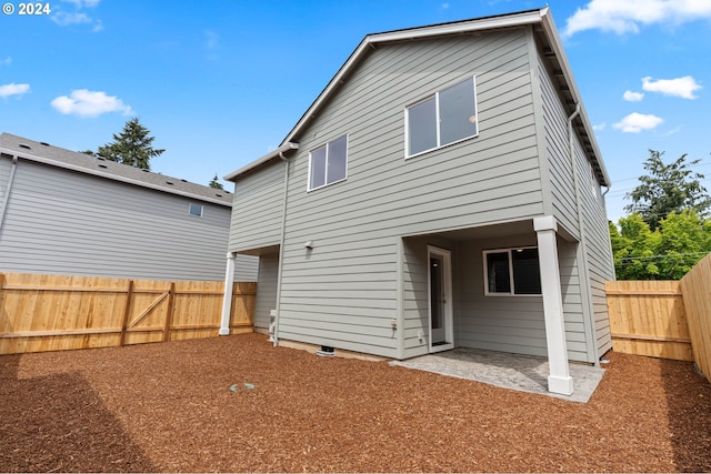 rear view of house featuring a patio area