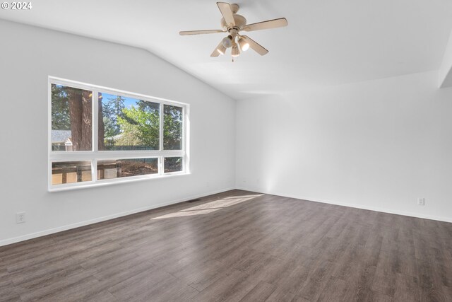 interior space featuring ceiling fan, lofted ceiling, wood-type flooring, and a healthy amount of sunlight