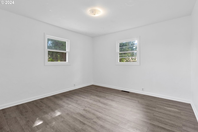 unfurnished room featuring hardwood / wood-style floors