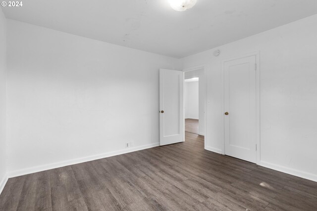 spare room with hardwood / wood-style floors