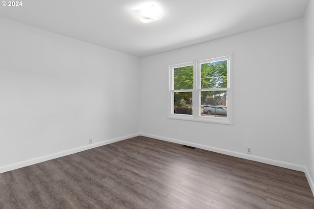 empty room featuring dark hardwood / wood-style floors