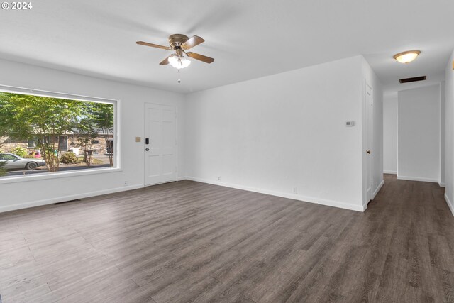 spare room with ceiling fan and hardwood / wood-style floors