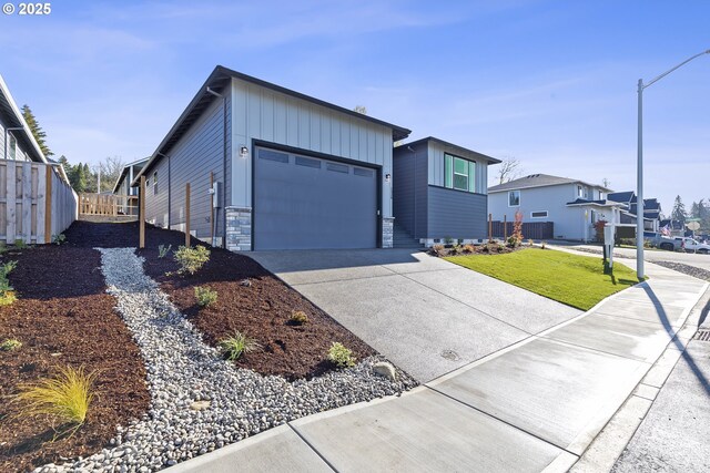 craftsman house with a front yard and a garage