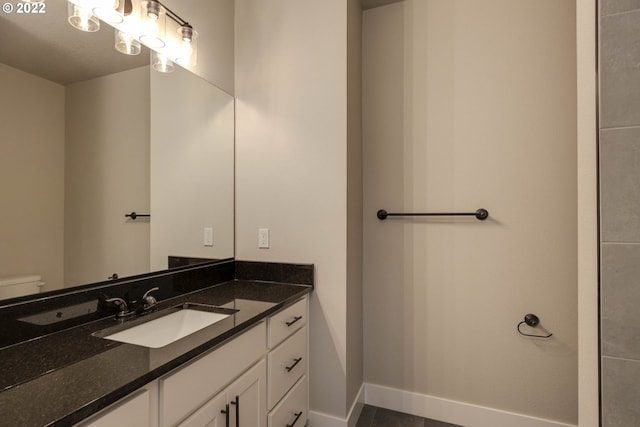 bathroom with toilet and vanity