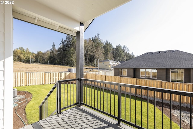 wooden terrace with a yard