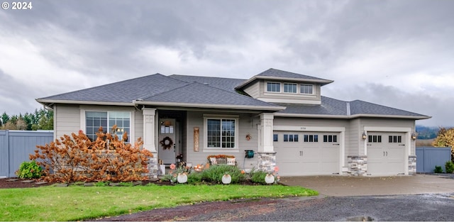 prairie-style home featuring a garage