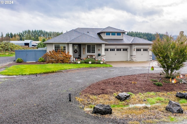 view of front of home featuring a garage and a front yard