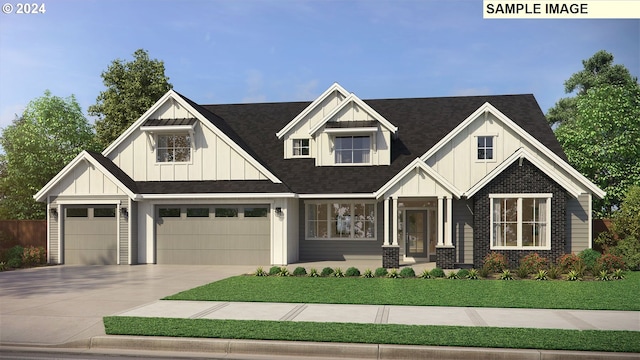 view of front of property with a garage and a front yard