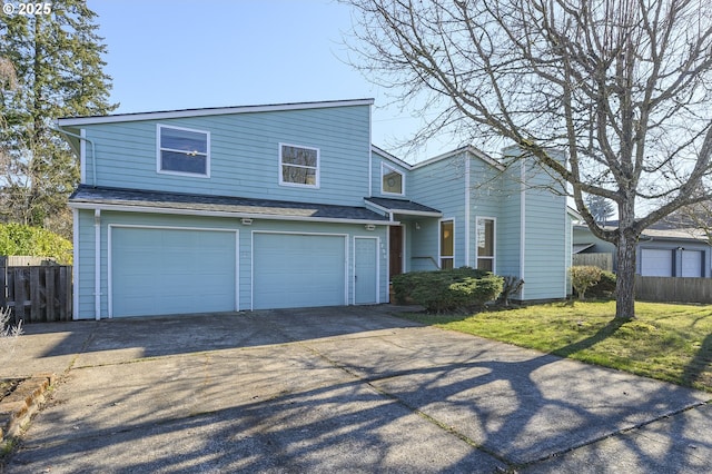 view of property with a garage and a front yard