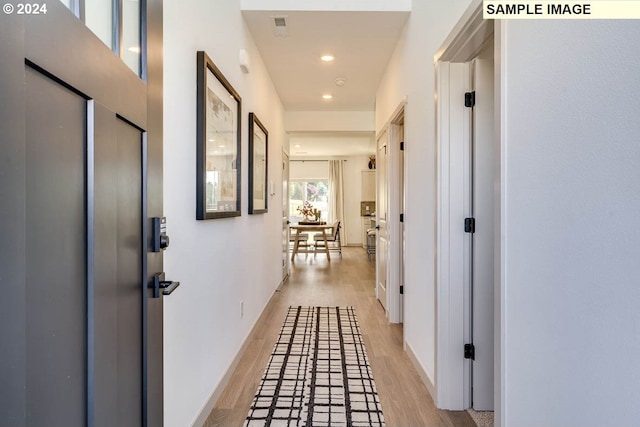 hallway featuring light hardwood / wood-style flooring