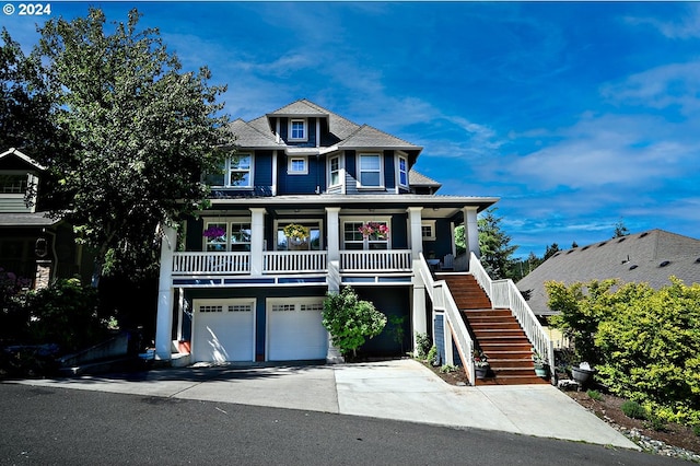 view of front of house with covered porch and a garage