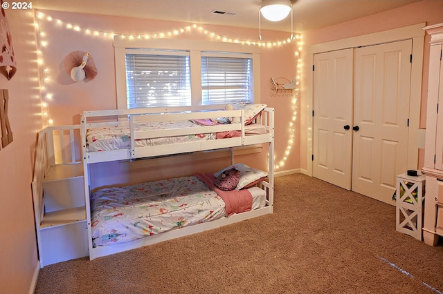 carpeted bedroom with a closet