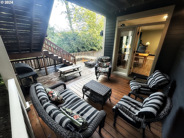 wooden terrace featuring a fire pit