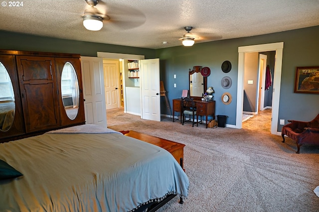 carpeted bedroom with a textured ceiling and ceiling fan