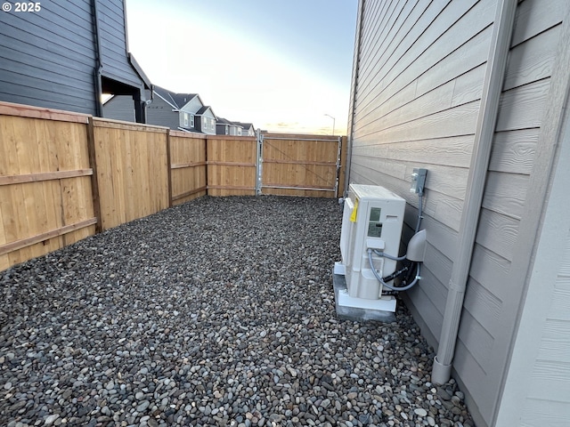 yard at dusk with ac unit