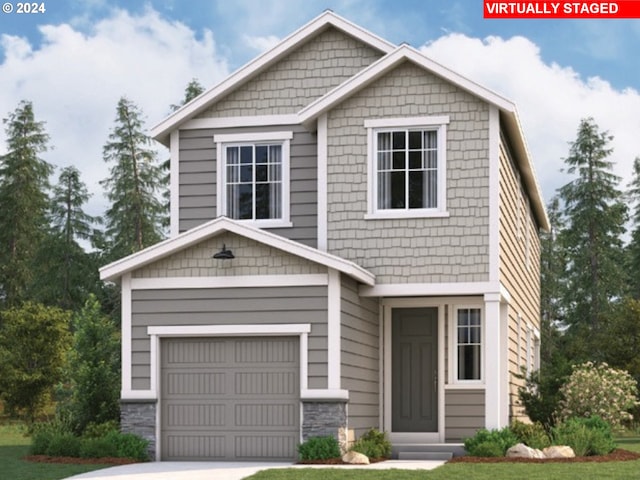 craftsman-style house with a garage and a front lawn