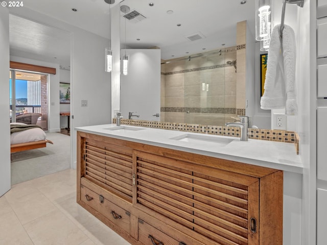 full bath featuring a sink, visible vents, ensuite bathroom, and a shower stall