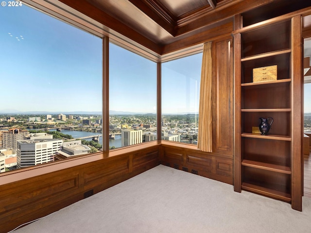 interior space featuring ornamental molding and a water view