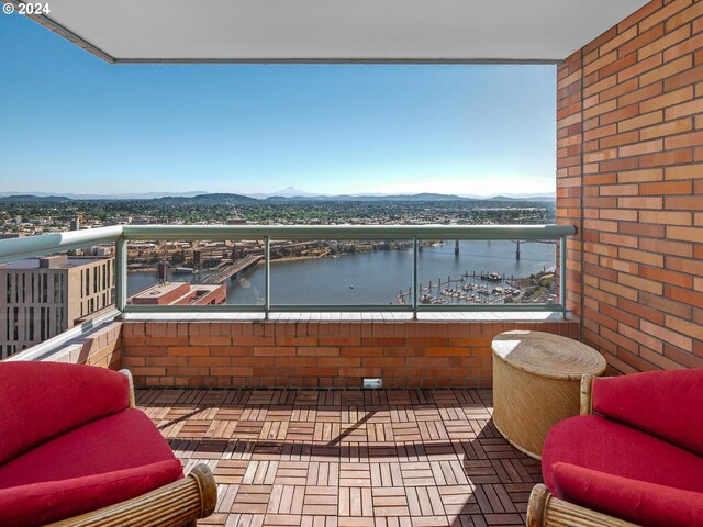 balcony with a water and mountain view