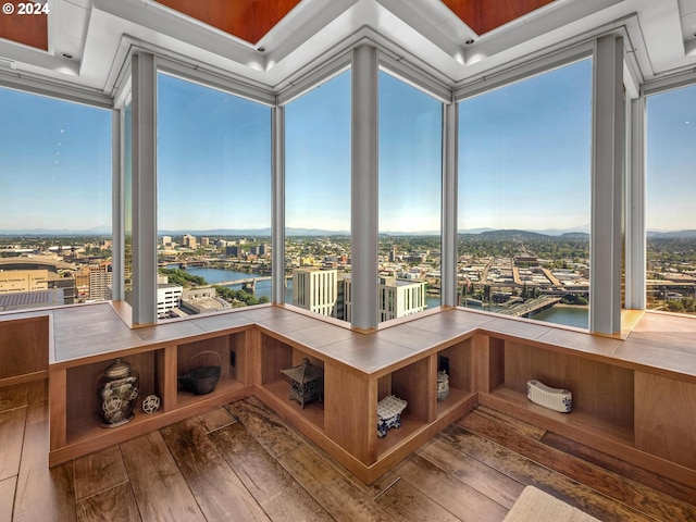 unfurnished sunroom featuring plenty of natural light and a water view