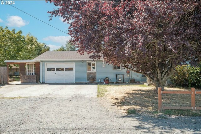 view of front of house featuring a garage and a carport