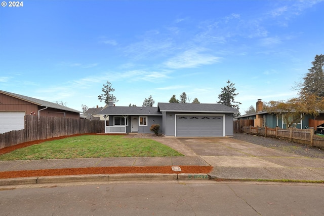 ranch-style home featuring a garage and a front yard