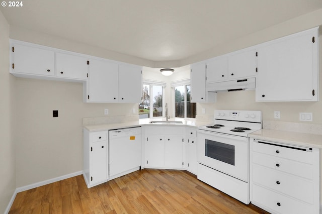 kitchen featuring white cabinets, white appliances, light hardwood / wood-style floors, and sink