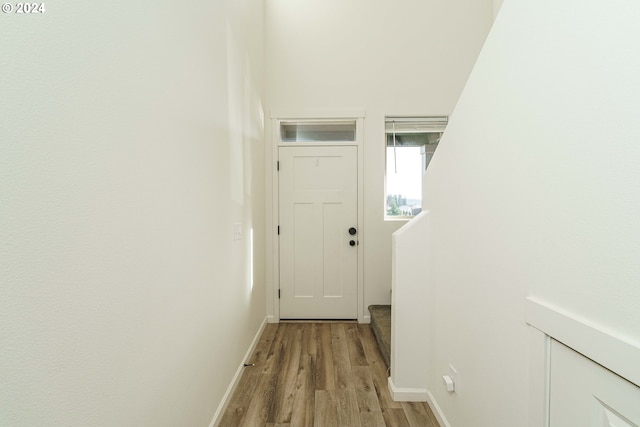 hall with light hardwood / wood-style floors