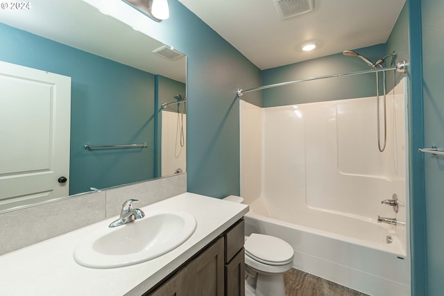 full bathroom featuring hardwood / wood-style floors, vanity, shower / bath combination, and toilet