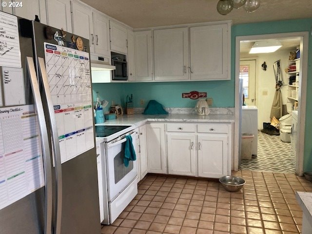 kitchen with stainless steel fridge, range hood, white electric range oven, light tile patterned flooring, and white cabinetry