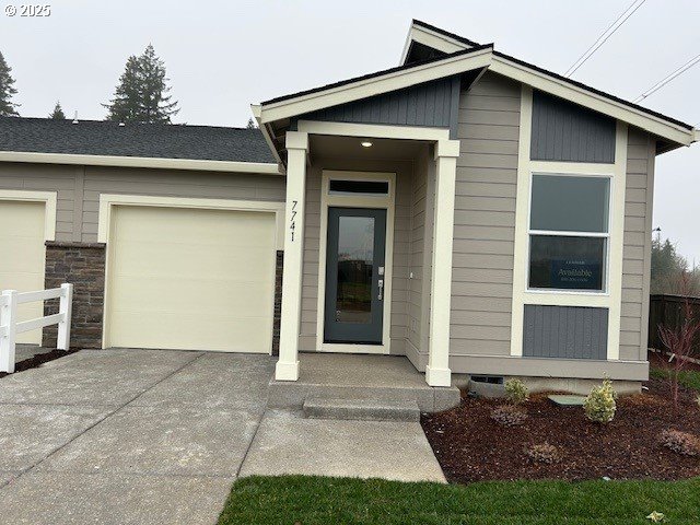 doorway to property with a garage