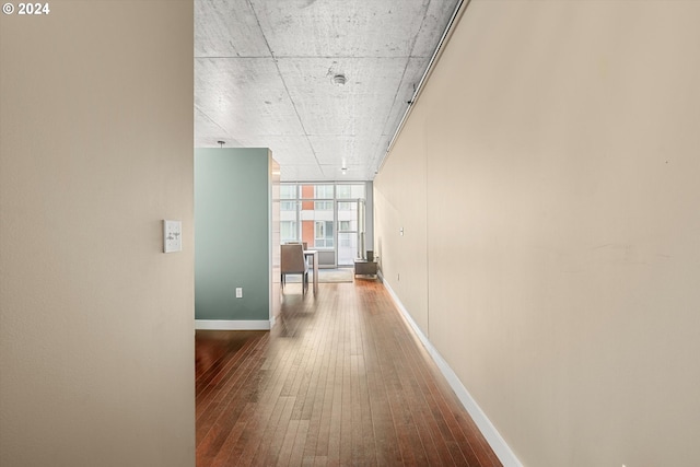 hall featuring hardwood / wood-style floors and expansive windows