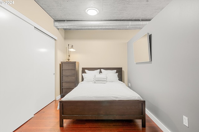 bedroom featuring wood-type flooring