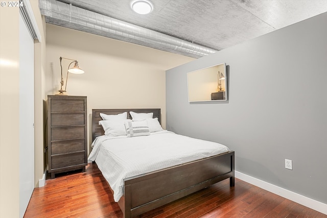 bedroom featuring wood-type flooring