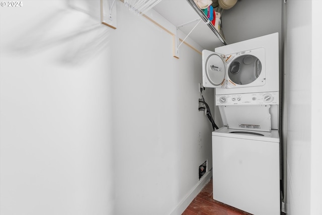 laundry area featuring stacked washer / drying machine