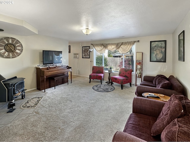 living room with light carpet, a textured ceiling, and a wood stove