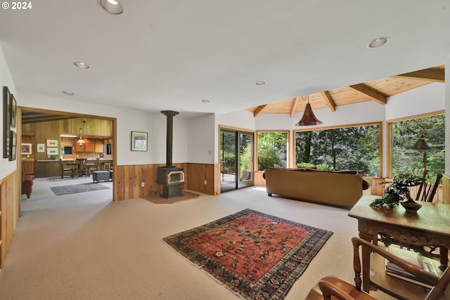 49356 Mckenzie Hwy, Vida, OR 97488 - living room featuring wooden walls, a wainscoted wall, a wood stove, carpet, and recessed lighting
