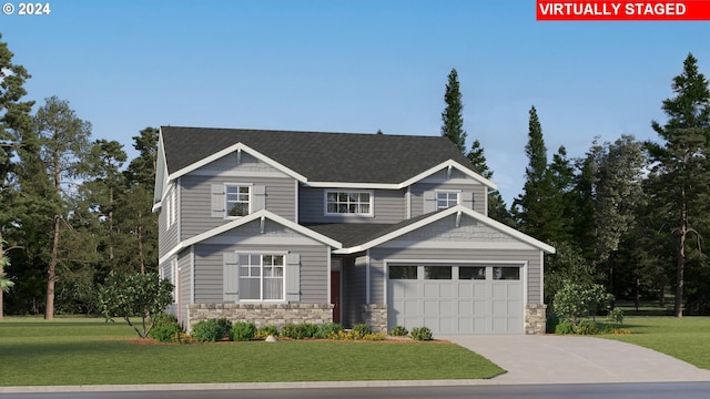 craftsman-style house featuring a front lawn and a garage