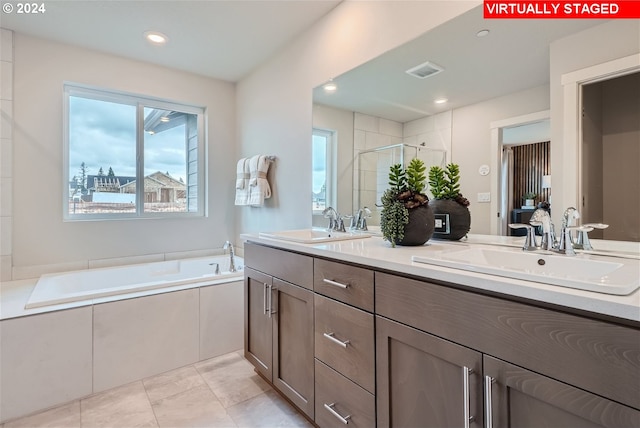 bathroom with vanity, separate shower and tub, and tile patterned flooring