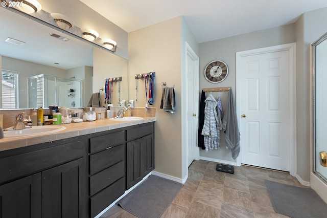 bathroom featuring vanity and walk in shower