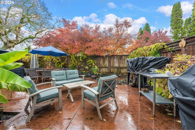 view of patio with area for grilling and an outdoor hangout area