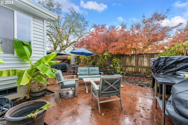 view of patio / terrace featuring outdoor lounge area and a hot tub