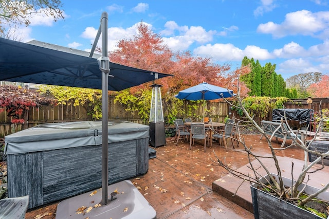 view of patio / terrace with a hot tub