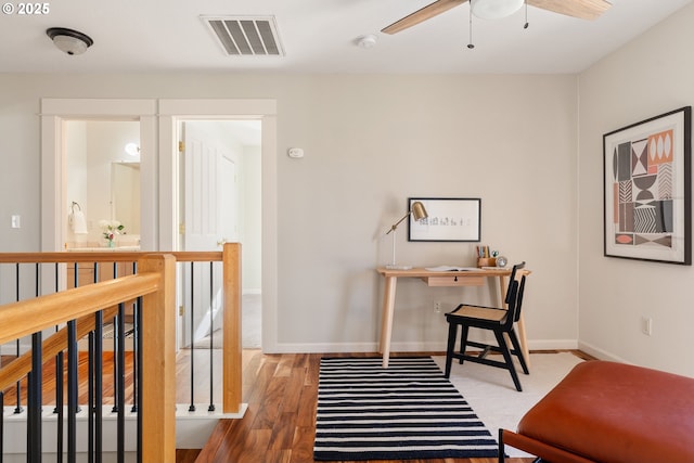 office space featuring hardwood / wood-style flooring and ceiling fan