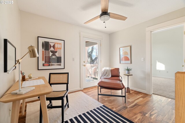 office space featuring ceiling fan and light wood-type flooring