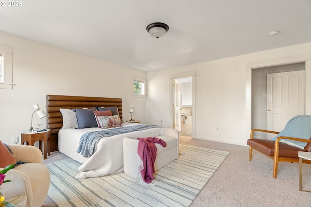 bedroom featuring light carpet